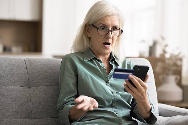 Bank Fraud Help elderly woman reporting online financial fraud case